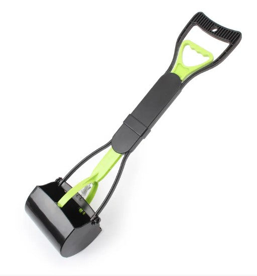 Black and green snow shovel on a white background