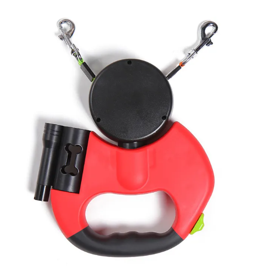 Red retractable dog leash with black flashlight on a white background