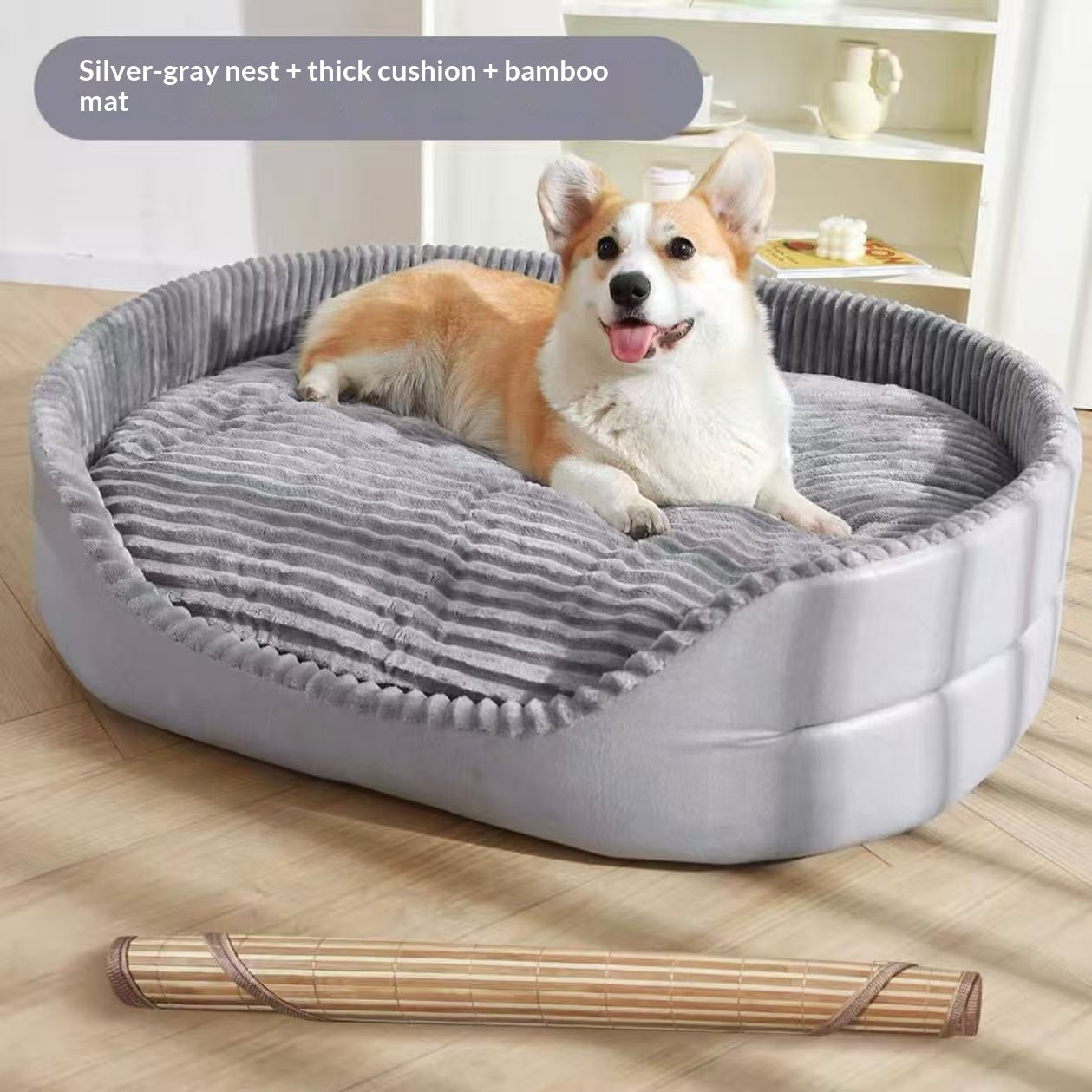 Dog lying on a gray pet bed with a thick cushion and bamboo mat on a wooden floor.
