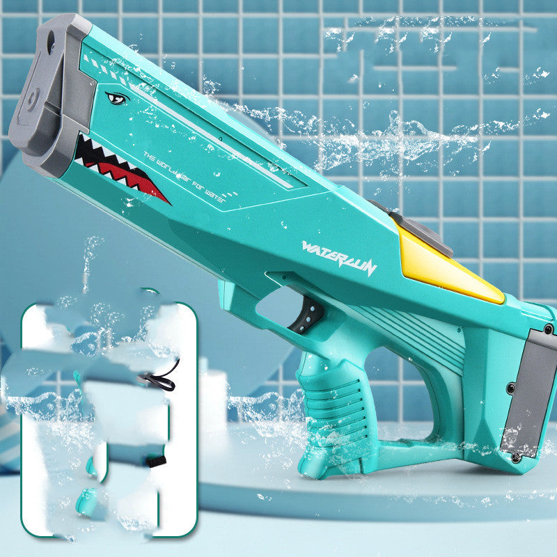 Turquoise water gun with shark design on a tiled bathroom floor