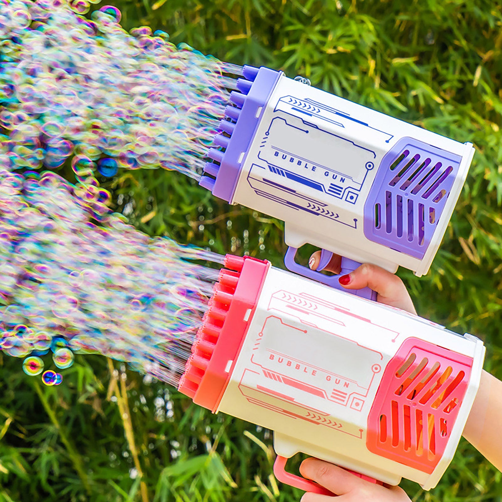 Bubble gun with colorful bubbles against a green outdoor background
