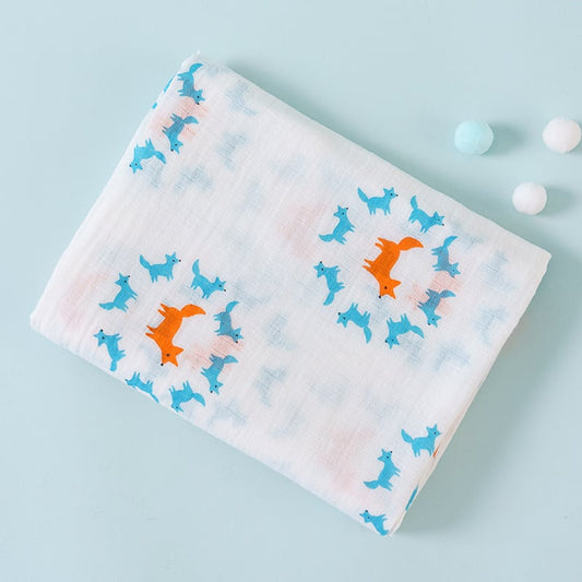 Baby blanket with fox pattern on a light blue background