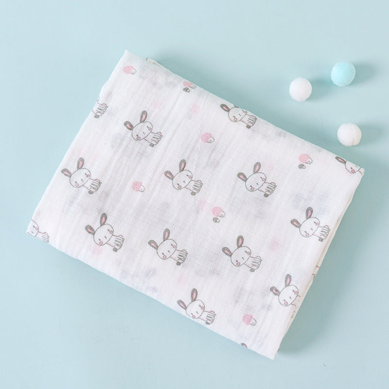 Baby blanket with bunny pattern on a light blue background