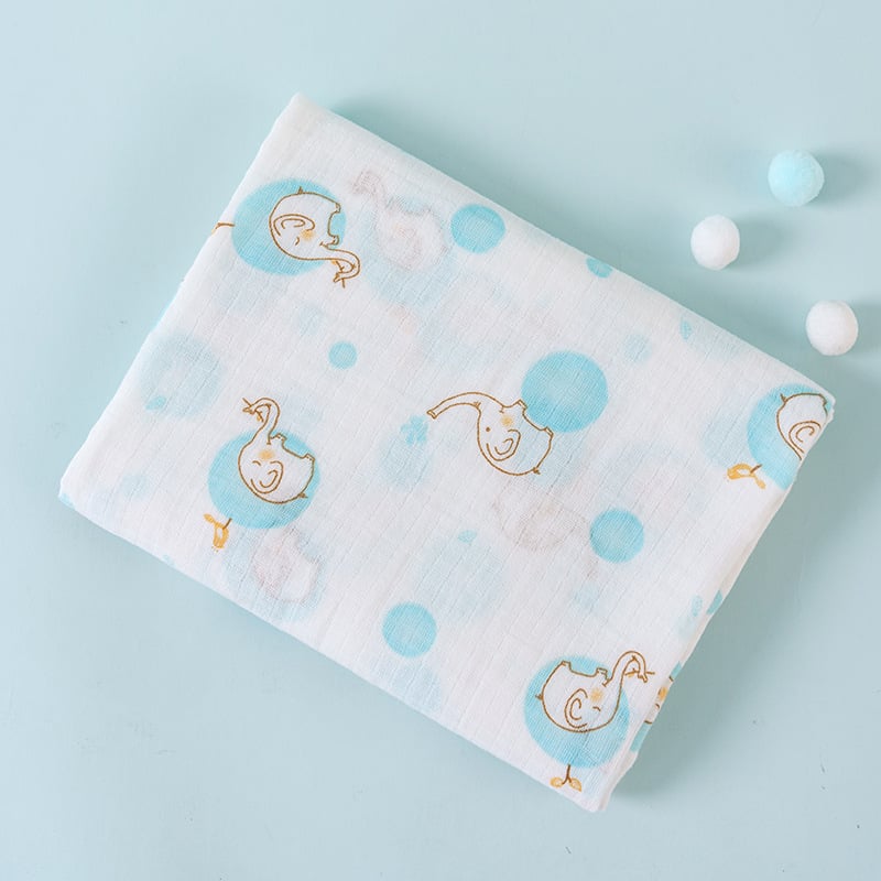 Baby blanket with duck pattern on a light blue background