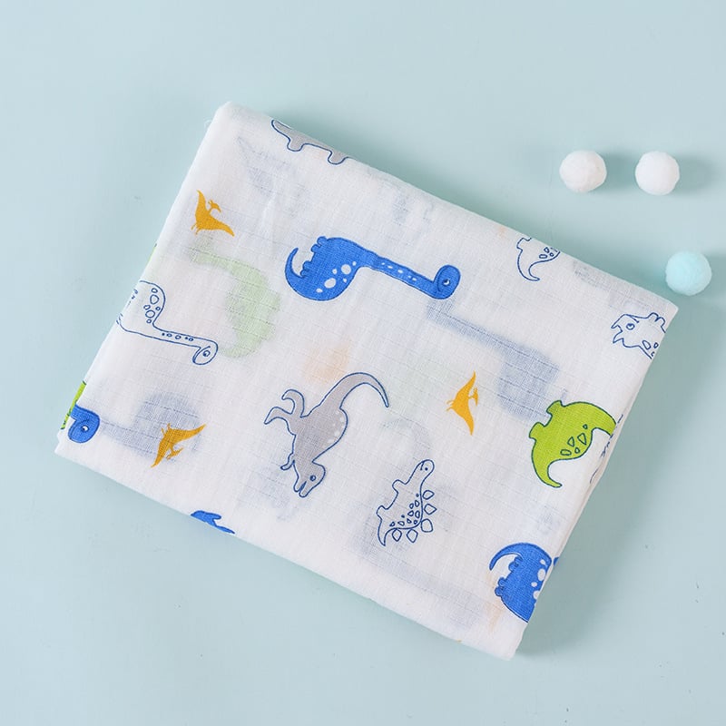 Fabric with dinosaur pattern on a light blue background