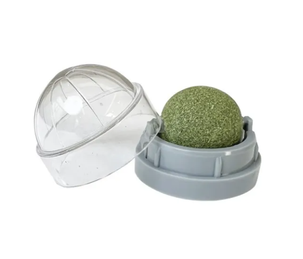 Green fishing ball in a transparent container on a white background