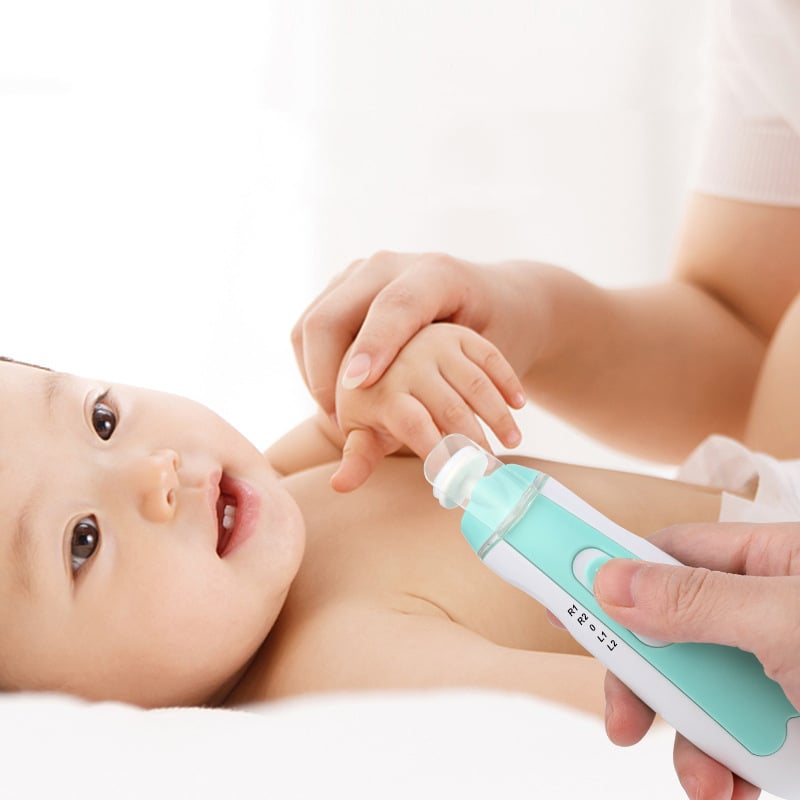 Baby receiving a skin check with a green and white device on a white background