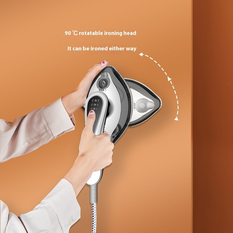 Hand holding a steam iron with a 90-degree rotatable ironing head on an orange background