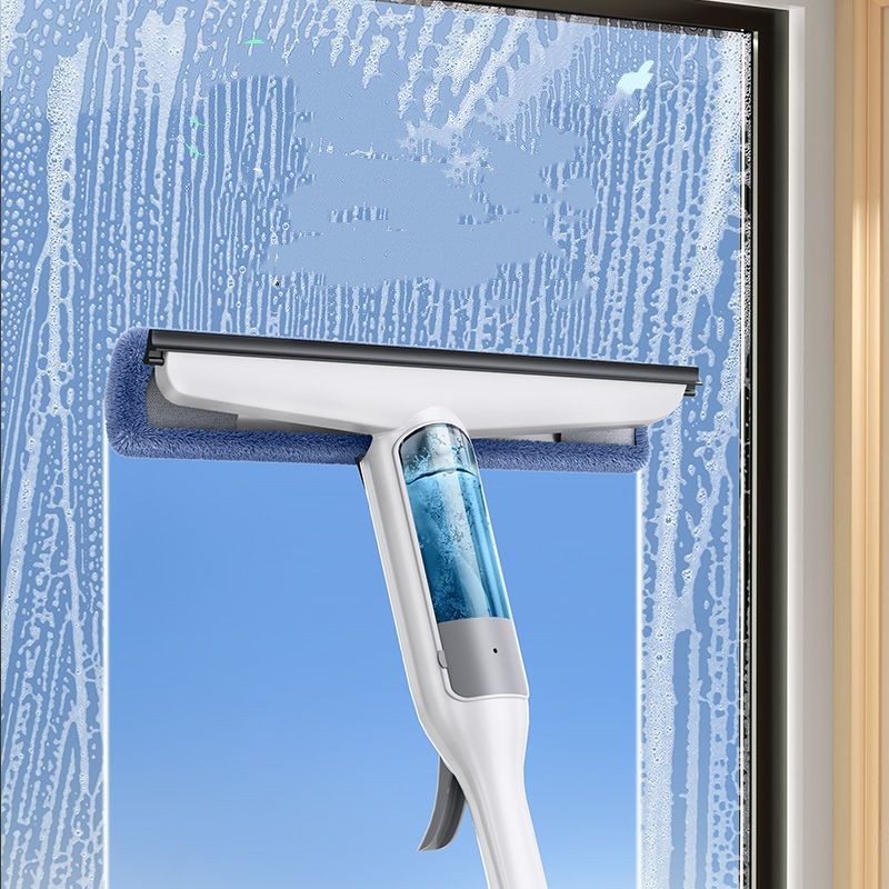 Window cleaning tool with a squeegee and spray head against a window background