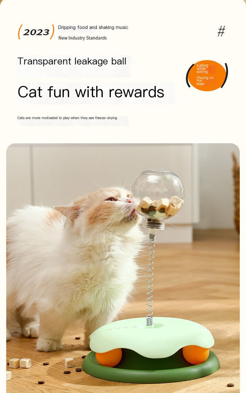 Cat playing with a transparent leakage ball toy on a wooden floor.