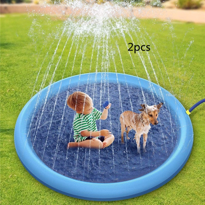 Children playing with a blue inflatable sprinkler pad on grass