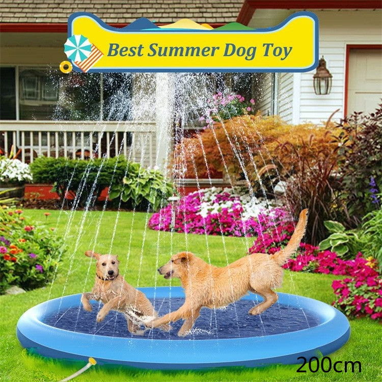 Two dogs playing in a large blue inflatable sprinkler pad in a garden setting.