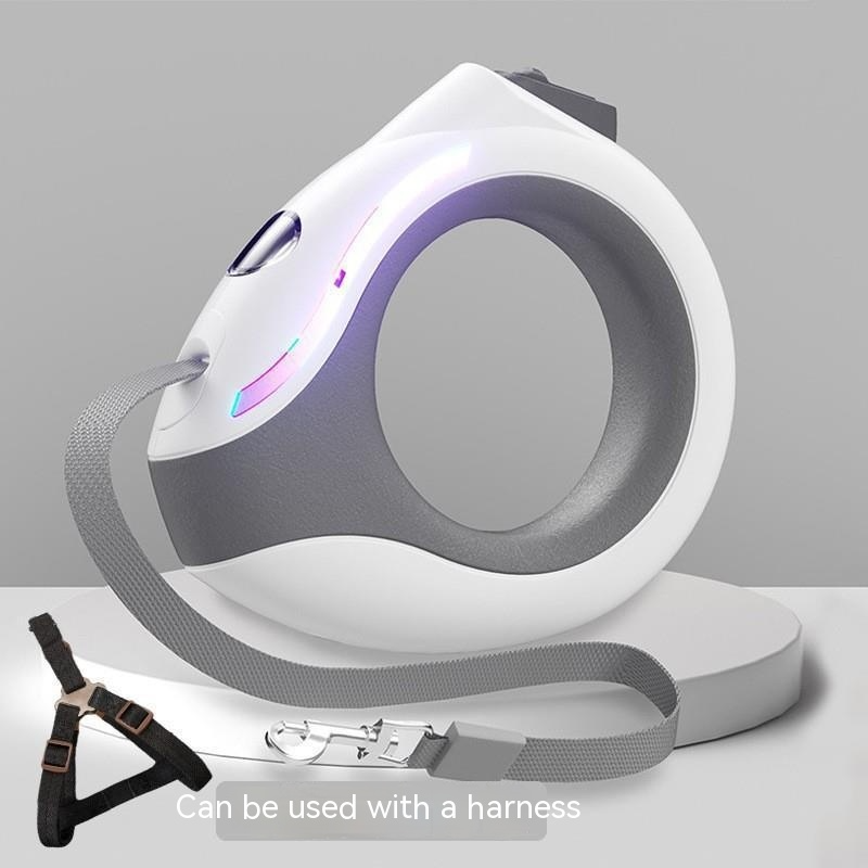 White and gray pet leash with a harness attachment on a light gray background