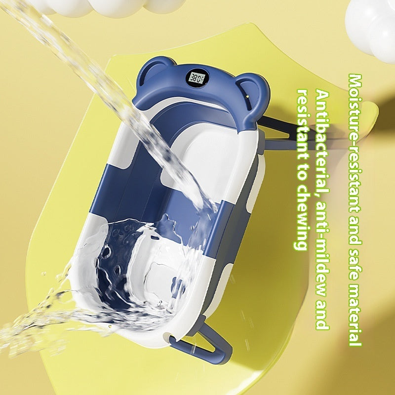 Blue and white electronic device with water being poured over it on a yellow background