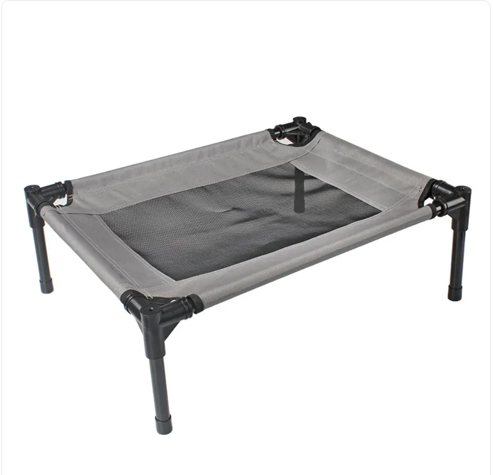 Portable pet cot with gray mesh and black metal frame on a white background