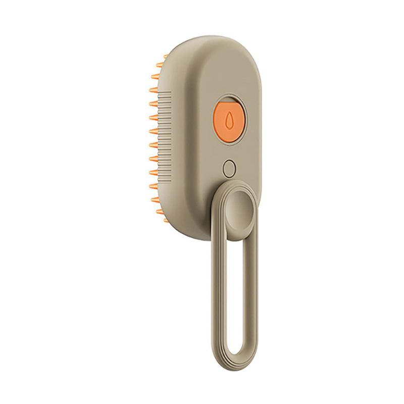 Beige grooming brush with orange button on a white background