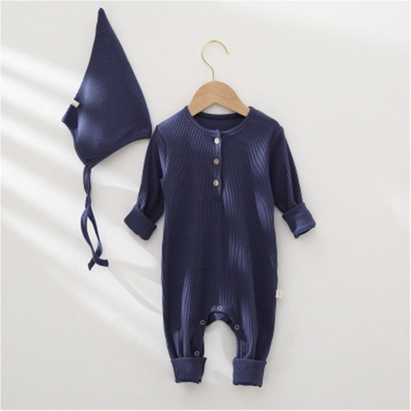 Navy baby romper with matching hat on a white background