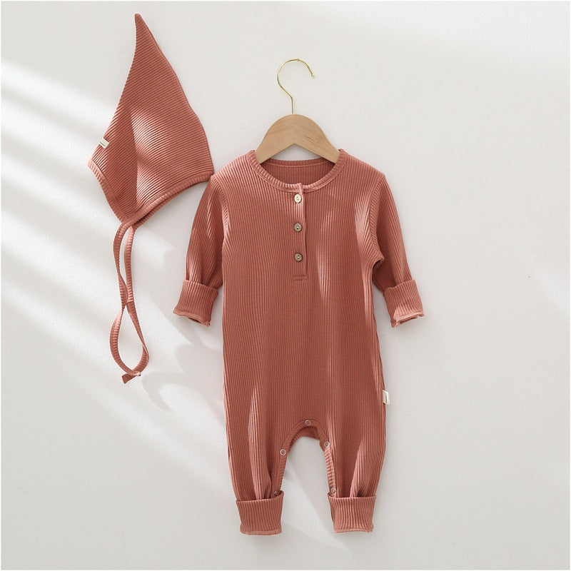 Baby romper and hat set on a white background