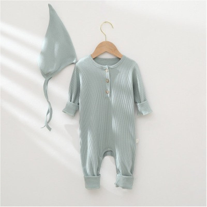 Baby romper and hat set on a white background